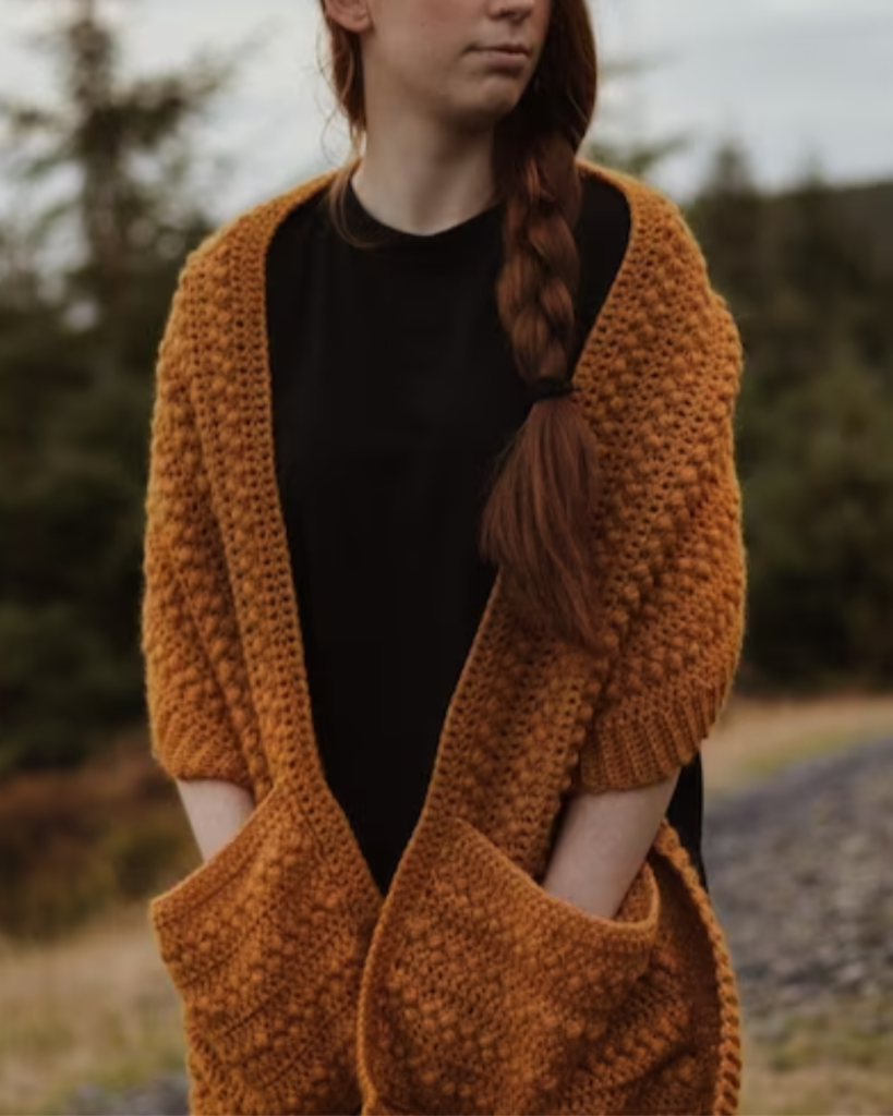 orange textured crochet pocket shawl