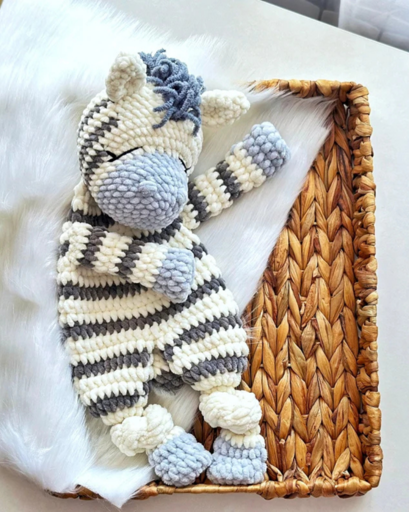 zebra crochet snuggler in a basket