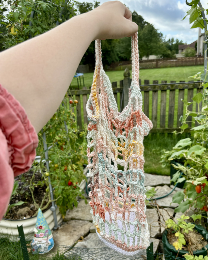hand holding crochet market bag