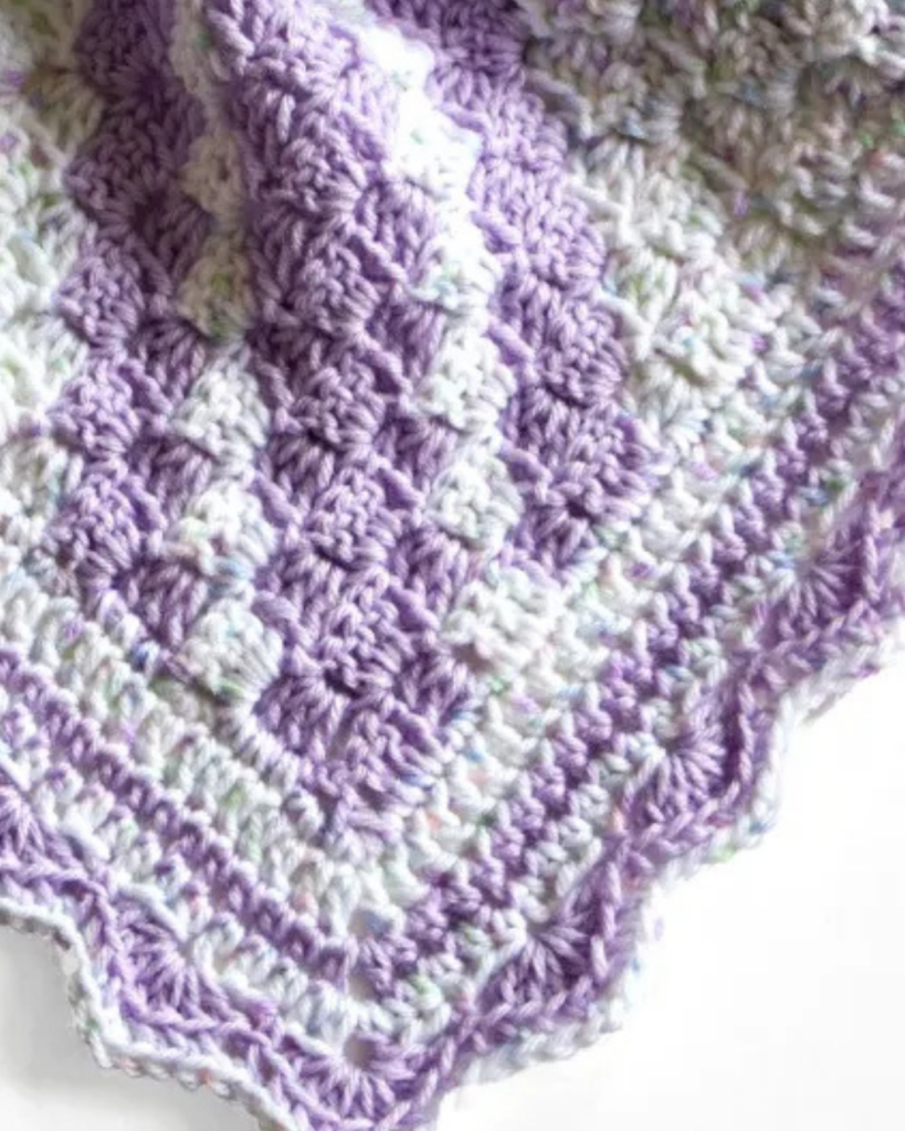 beginner-friendly crochet baby blanket in light pastel colors