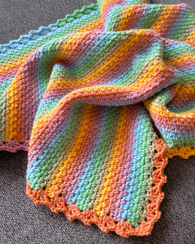 cozy crochet baby blanket with simple stitch pattern
