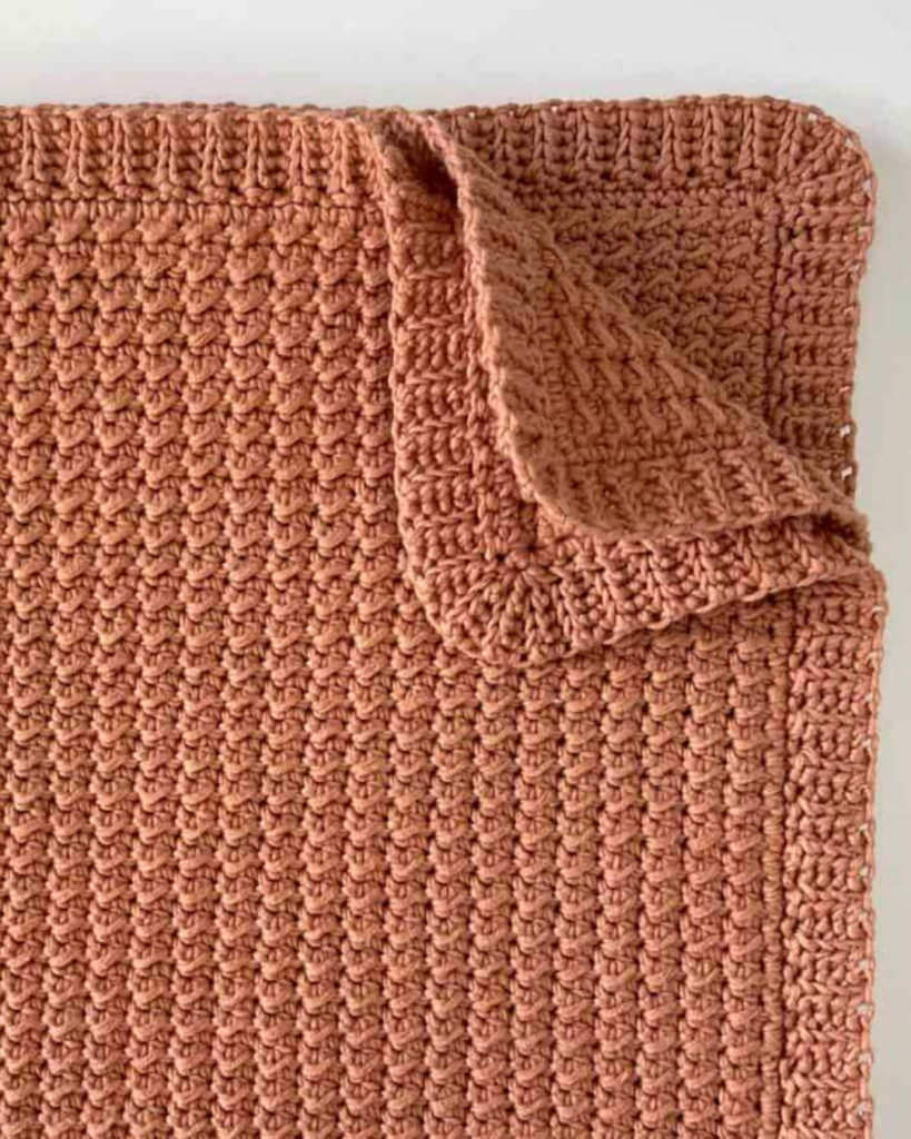 detailed view of soft crochet baby blanket texture