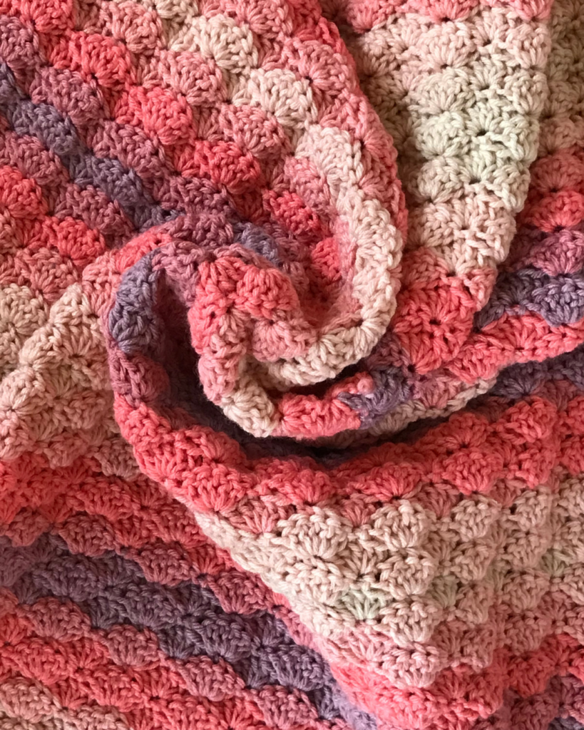 textured crochet baby blanket showing beginner-friendly stitches