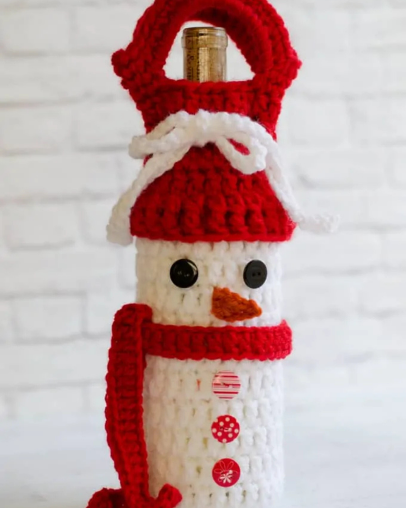 Snowman crochet wine bottle holder designed for gifting or carrying a bottle