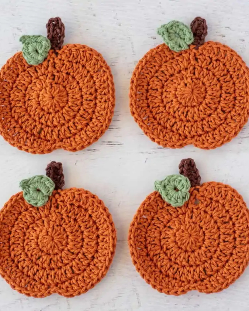 Set of pumpkin crochet coasters made with simple beginner-friendly stitches