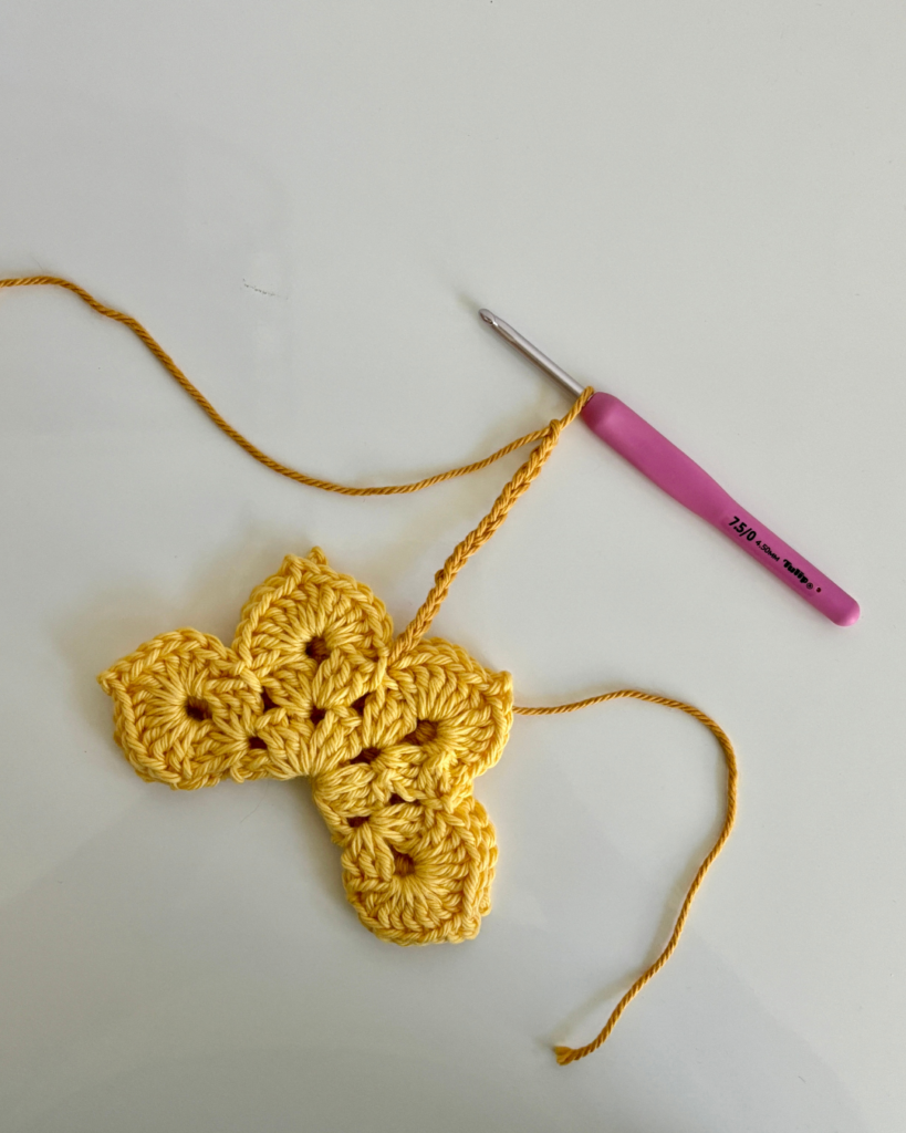 crochet butterfly applique folded with body in progress