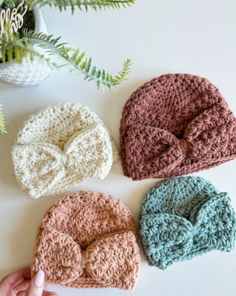 crochet baby bonnet with a sweet bow detail and soft spring-inspired stitching