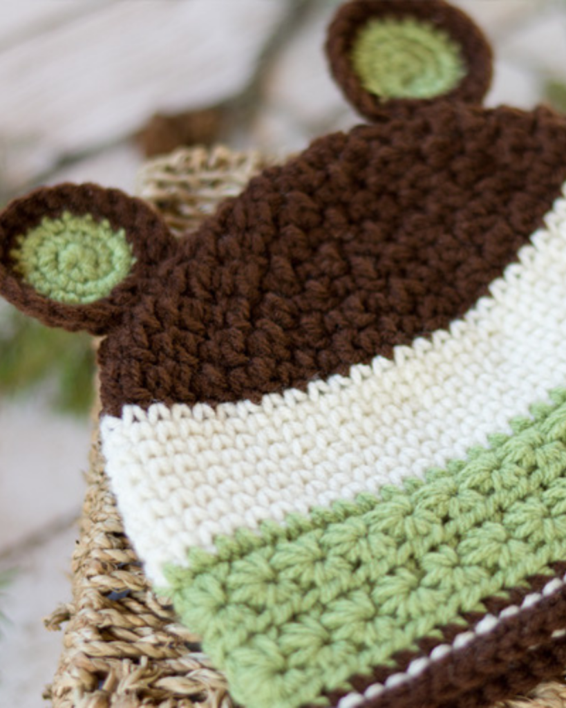 crochet baby bear hat with soft textured stitches and rounded bear ears