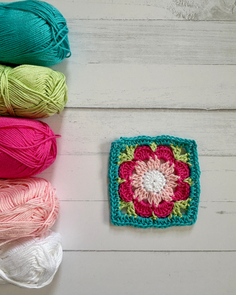 Close-up of flower granny square for crochet baby dress