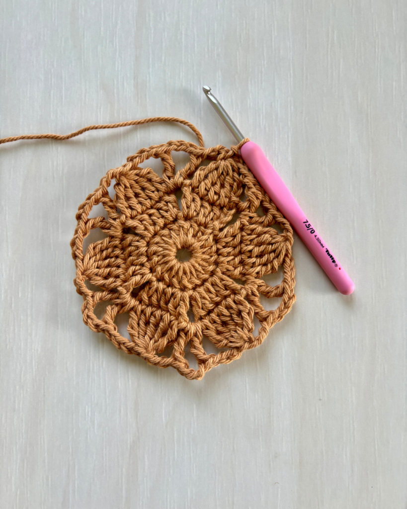 close up progress photos of crochet floral hexagon