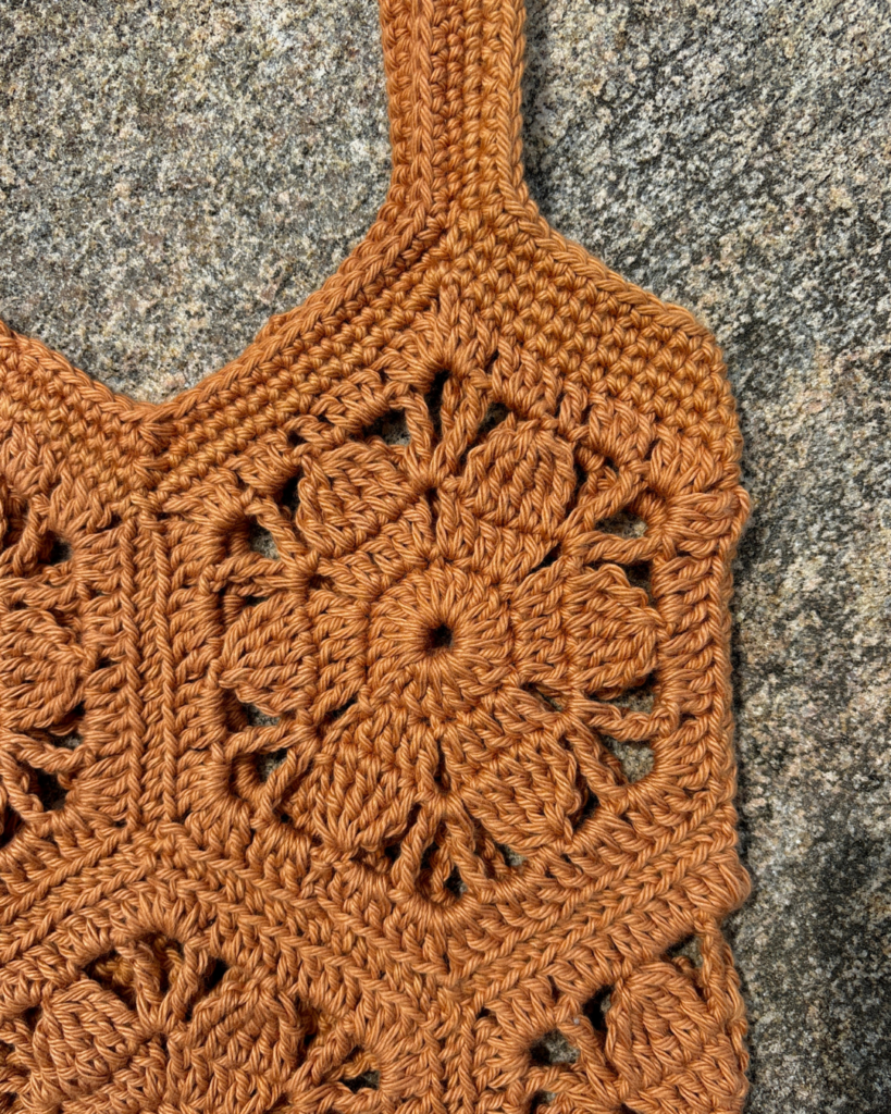 Close-up of floral hexagon motifs on crochet market tote
