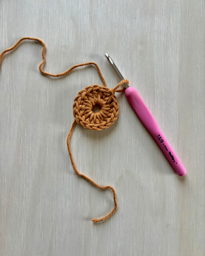 close up progress photos of crochet floral hexagon