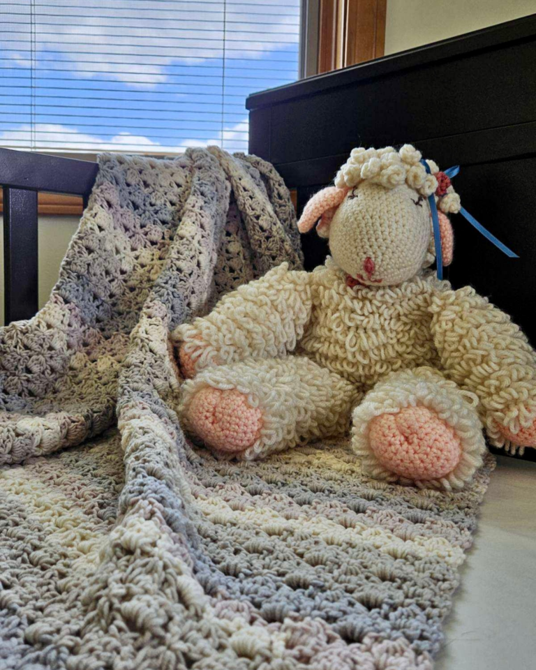 easy crochet lace baby blanket pattern in soft neutral colors