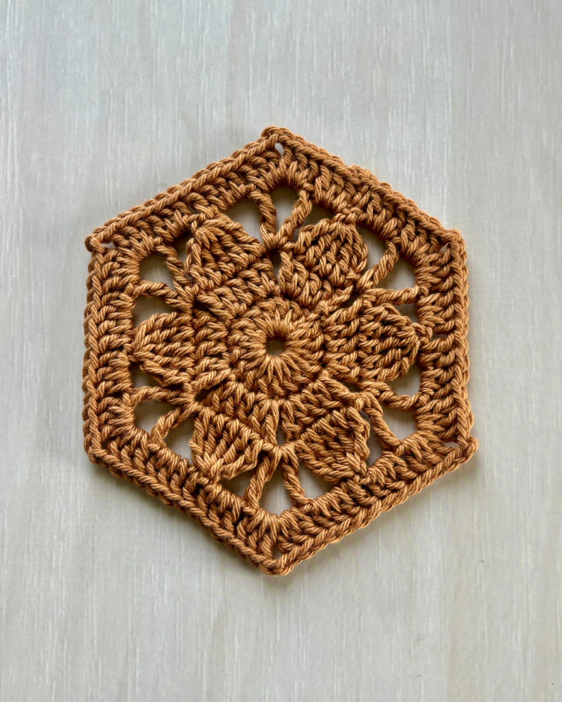 close up progress photos of crochet floral hexagon