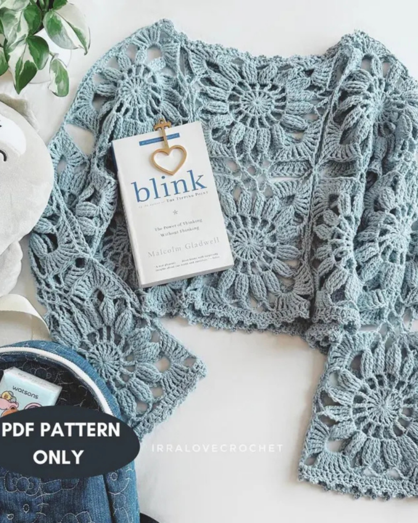 Crochet summer top featuring daisy-inspired motifs and lightweight construction