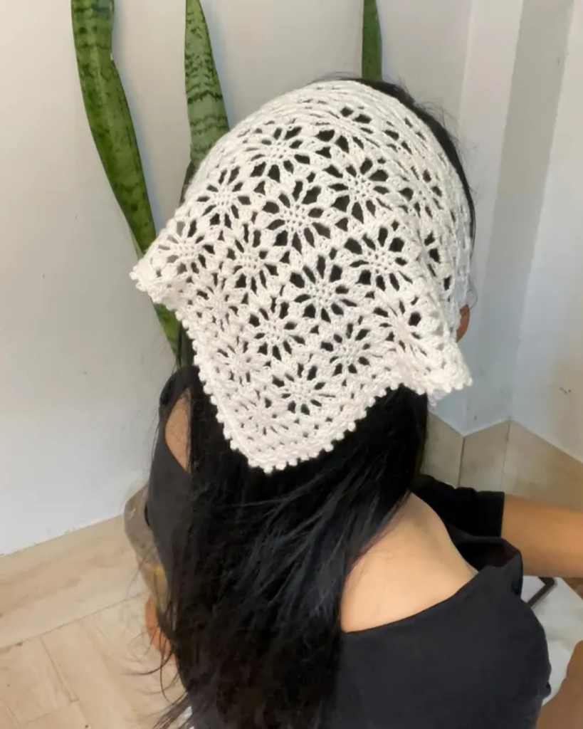 Crochet bandana with floral-inspired details
