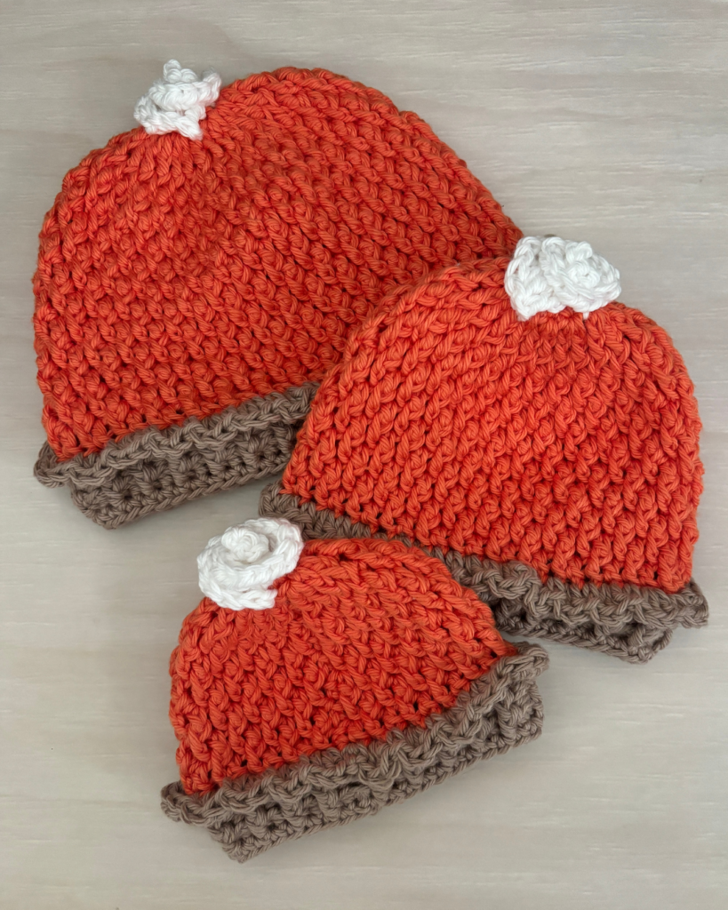 Pumpkin Pie Baby Hat crochet pattern with alpine stitch texture, ruffled pie crust brim, and whipped cream topper