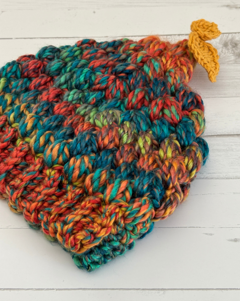 Close-up of the puff stitch texture on the Woodland Wanderer crochet toddler hat